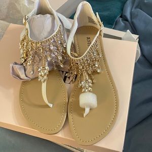 Flat buckle embellished sandals